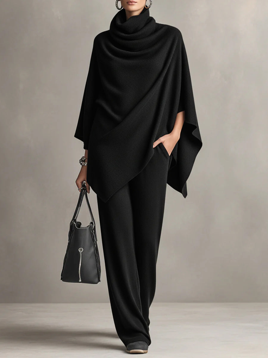 Two-piece set featuring a high-neck cape-style top and wide-leg trousers.