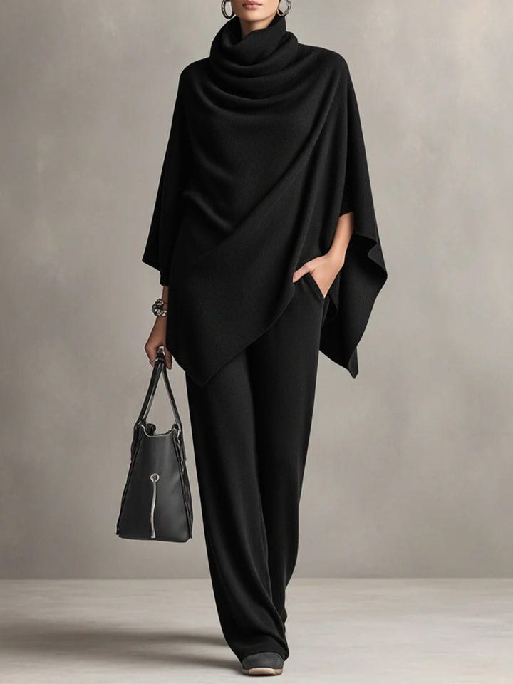 Two-piece set featuring a high-neck cape-style top and wide-leg trousers.